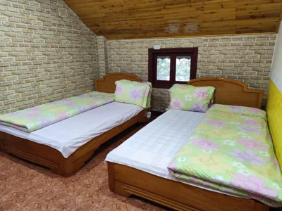 Chambre lits jumeaux économique — Quê Hương house